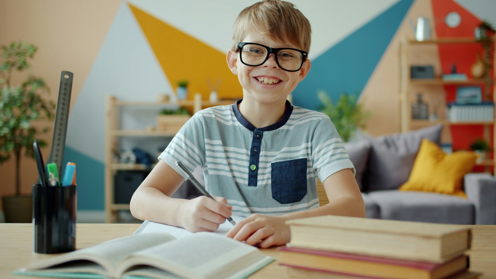 Happy child learning at his desk